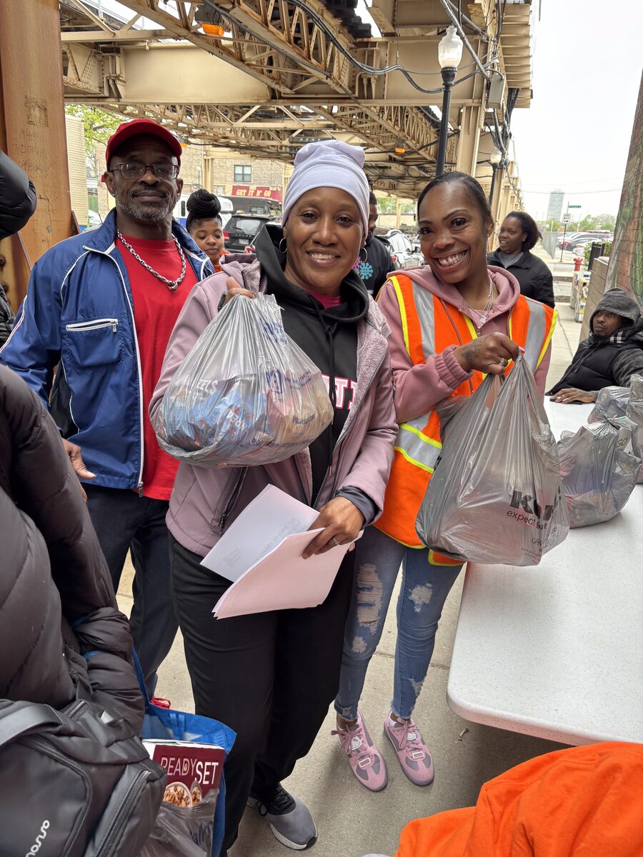 Project H.O.O.D. team members handing out supplies during neighborhood outreach